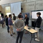 Students demo their projects to faculty.